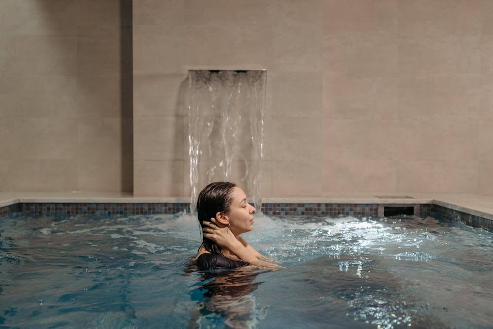 Woman relaxing in hydrotherapy water treatment pool